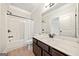 Bathroom features a shower and tub combination with a white shower curtain and dark vanity at 3865 Rifflepool Ct, Douglasville, GA 30135