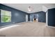 Bedroom featuring carpet, a ceiling fan, and a backyard view at 3865 Rifflepool Ct, Douglasville, GA 30135