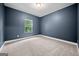 Bedroom with a large window and neutral carpet at 3865 Rifflepool Ct, Douglasville, GA 30135