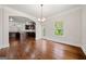 Spacious dining room with hardwood floors and open to the kitchen; great for entertaining at 3865 Rifflepool Ct, Douglasville, GA 30135