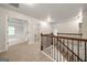 Upstairs hallway view of bedrooms and a laundry room at 3865 Rifflepool Ct, Douglasville, GA 30135