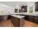 Beautiful kitchen with granite countertops, dark cabinets, stainless steel appliances, and an island at 3865 Rifflepool Ct, Douglasville, GA 30135