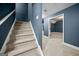 Carpeted staircase with white railing leading to an upper level in this home's interior at 3865 Rifflepool Ct, Douglasville, GA 30135