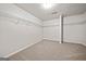 Walk-in closet features neutral carpet and metal shelving at 3865 Rifflepool Ct, Douglasville, GA 30135