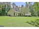 A spacious backyard with a well-manicured lawn, ideal for relaxation and entertaining at 1709 Reese Rd, Sharpsburg, GA 30277
