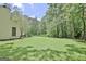 Expansive backyard with a large grassy area, perfect for outdoor activities and recreation at 1709 Reese Rd, Sharpsburg, GA 30277