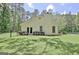 Well-maintained backyard featuring a lush lawn, privacy fence, and mature trees at 1709 Reese Rd, Sharpsburg, GA 30277