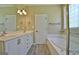 Bathroom featuring double vanity with step in shower and soaking tub at 1709 Reese Rd, Sharpsburg, GA 30277