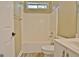 Well-lit bathroom with a shower-tub combo and a single sink vanity at 1709 Reese Rd, Sharpsburg, GA 30277