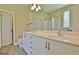 Bright bathroom with double vanity, a large mirror, tiled floor and step in shower at 1709 Reese Rd, Sharpsburg, GA 30277