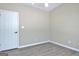 A bedroom view with hardwood floors, a ceiling fan, one door and neutral walls at 1709 Reese Rd, Sharpsburg, GA 30277