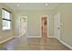 Large bedroom with wood floors, two closets, and an adjacent bathroom with shower at 1709 Reese Rd, Sharpsburg, GA 30277
