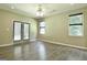 Light-filled primary bedroom with large windows and a sliding glass door at 1709 Reese Rd, Sharpsburg, GA 30277