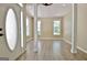 Light-filled foyer showcases wood-look floors, decorative columns, and modern lighting at 1709 Reese Rd, Sharpsburg, GA 30277