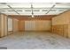 Spacious garage with paneled walls provides ample storage and parking at 1709 Reese Rd, Sharpsburg, GA 30277