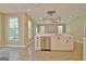 Bright open kitchen with stainless steel appliances, island, and ample natural light at 1709 Reese Rd, Sharpsburg, GA 30277