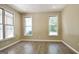 Inviting living room features ample natural light and modern wood-look flooring at 1709 Reese Rd, Sharpsburg, GA 30277