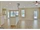 Bright and spacious living room features hardwood floors, ceiling fan, and breakfast bar at 1709 Reese Rd, Sharpsburg, GA 30277
