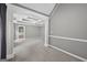 Large bedroom with carpet flooring, ceiling fan, and an archway to the bathroom at 65 Pecan Ln, Oxford, GA 30054