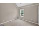 Cozy bedroom featuring neutral walls, plush carpeting, and a window that offers natural light at 65 Pecan Ln, Oxford, GA 30054