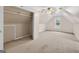 Upstairs bonus room with carpet flooring, a built in closet, and a ceiling fan at 65 Pecan Ln, Oxford, GA 30054