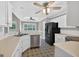 Well-lit kitchen featuring white cabinets, modern appliances, and a decorative tile floor, blending style and functionality at 65 Pecan Ln, Oxford, GA 30054