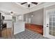 Open-concept kitchen and living area, featuring white cabinets and unique tiling that adds charm and character at 65 Pecan Ln, Oxford, GA 30054