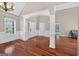 Elegant room featuring hardwood floors, paneled walls, large windows, and an open floor plan perfect for entertaining at 65 Pecan Ln, Oxford, GA 30054
