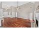 Spacious living room with gleaming hardwood floors, a fireplace, and ample natural light creating a warm ambiance at 65 Pecan Ln, Oxford, GA 30054