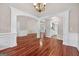 Elegant living room showcasing hardwood floors, stylish archways, and decorative trim, perfect for entertaining and relaxation at 65 Pecan Ln, Oxford, GA 30054