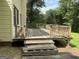 Wooden back deck with railings, offering outdoor enjoyment and entertaining space at 807 Oak Bridge Ln, Fayetteville, GA 30214