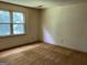 Bedroom featuring large windows and neutral carpeting at 807 Oak Bridge Ln, Fayetteville, GA 30214