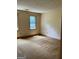Spacious bedroom featuring multiple windows for natural light and air ventilation at 807 Oak Bridge Ln, Fayetteville, GA 30214