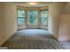 Spacious bedroom featuring multiple windows to allow ample natural light at 807 Oak Bridge Ln, Fayetteville, GA 30214