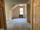 Bedroom features large windows for natural light and closet for storage space at 807 Oak Bridge Ln, Fayetteville, GA 30214