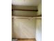 Walk-in closet featuring built-in shelving for ample storage in home at 807 Oak Bridge Ln, Fayetteville, GA 30214