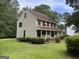Attractive two-story home with front porch, complemented by a well-maintained lawn at 807 Oak Bridge Ln, Fayetteville, GA 30214