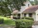 Charming two-story home with a welcoming front porch and well-manicured landscaping at 807 Oak Bridge Ln, Fayetteville, GA 30214