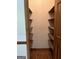 Pantry with wooden shelves and tile flooring at 807 Oak Bridge Ln, Fayetteville, GA 30214