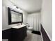 Bathroom boasting a classic vanity with granite countertop and a shower with curtain at 6192 Collins Ne St, Covington, GA 30014