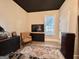 Comfortable bedroom featuring a dark ceiling, bright walls, and neutral decor elements at 6192 Collins Ne St, Covington, GA 30014