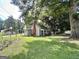 Well-maintained house with a large yard, and beautiful trees at 6192 Collins Ne St, Covington, GA 30014