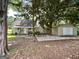 A beautiful single Gathering home with a spacious front yard, mature trees and a detached garage at 6192 Collins Ne St, Covington, GA 30014