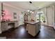 Open-concept kitchen featuring a central island, a work desk, and lots of natural light at 6192 Collins Ne St, Covington, GA 30014