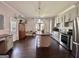 Spacious kitchen with an island, stainless steel appliances, ample cabinets, and lots of natural light at 6192 Collins Ne St, Covington, GA 30014