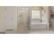 Elegant bathroom featuring a glass-enclosed shower, soaking tub, and stylish decorative accents at 687 Edgar St # 83, Hampton, GA 30228