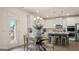 Bright dining area featuring stylish furniture, modern kitchen, and ample natural light at 687 Edgar St # 83, Hampton, GA 30228