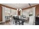 Dining room features an elegant chandelier, stylish decor and an opening to the living room at 687 Edgar St # 83, Hampton, GA 30228