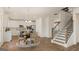 View of the open living space with view of the kitchen, stairs and dining area at 687 Edgar St # 83, Hampton, GA 30228