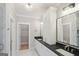 Bathroom featuring double sinks, vanity, and a walk-in closet at 1100 Thomas St, Woodstock, GA 30188